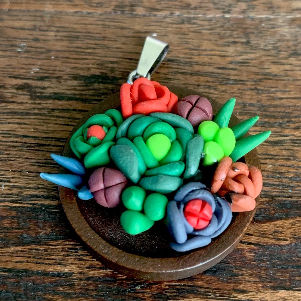 Handmade polymer clay pendant.